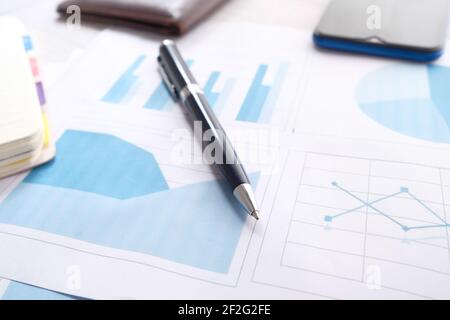 financial graph, calculator and notepad on table  Stock Photo