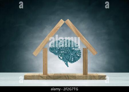 Human brain with metallic gears into iconic house Stock Photo