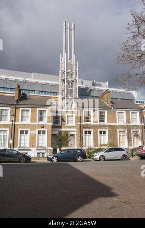 Industrial steel chimneys at the rear of Chelsea and Westminster Hospital on Fulham Road, Chelsea, London, SW10, U.K. Stock Photo