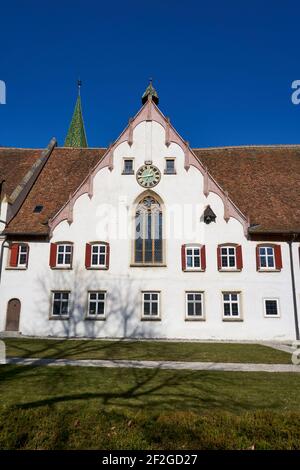 A white painted wall of an old building in Blaubeuren, Germany under a clear blue sky background Stock Photo