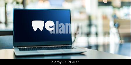 POZNAN, POL - FEB 6, 2021: Laptop computer displaying logo of WeTransfer, an internet-based computer file transfer service based in the Netherlands, f Stock Photo