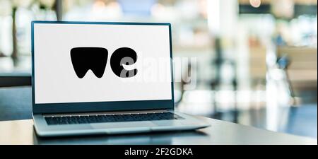 POZNAN, POL - FEB 6, 2021: Laptop computer displaying logo of WeTransfer, an internet-based computer file transfer service based in the Netherlands, f Stock Photo