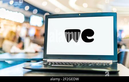 POZNAN, POL - FEB 6, 2021: Laptop computer displaying logo of WeTransfer, an internet-based computer file transfer service based in the Netherlands, f Stock Photo