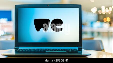 POZNAN, POL - FEB 6, 2021: Laptop computer displaying logo of WeTransfer, an internet-based computer file transfer service based in the Netherlands, f Stock Photo