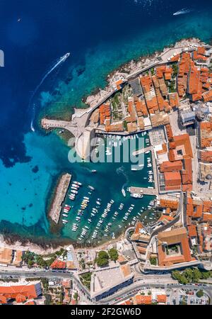 Aerial overhead drone shot of Dubrovnik old town port in Adriatic sea in Croatia summer Stock Photo