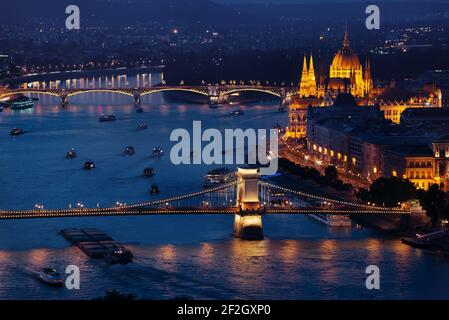 Budapest Parliament and Bridges illuminated in the evening, Hungary Stock Photo
