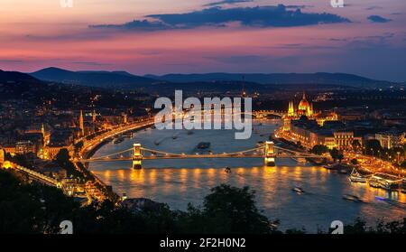 Aerial view of Budapest and illuminated landmarks at sunset Stock Photo