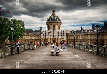 PARIS, FRANCE - AUGUST 26, 2016. View on facade of Institut de France in Paris from Pont des Arts at cloudy day