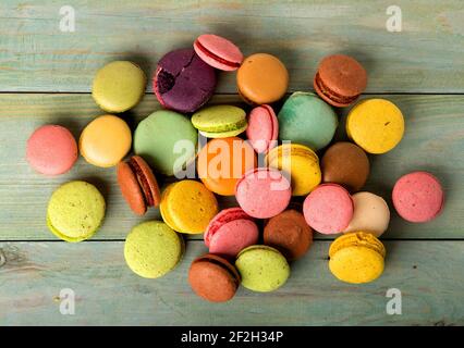 Assortment of sweet macarons on a wooden table Stock Photo