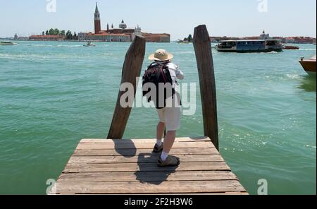 Tourist making photo of San Giorgio Maggiore in Venice, Italy Stock Photo