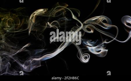 Abstract colorful smoke lines with smooth shape in black backdrop Stock Photo