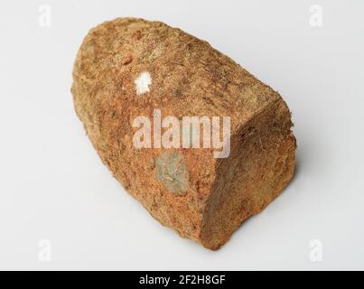 Piece of forgotten bread with mould isolated on white background Stock Photo