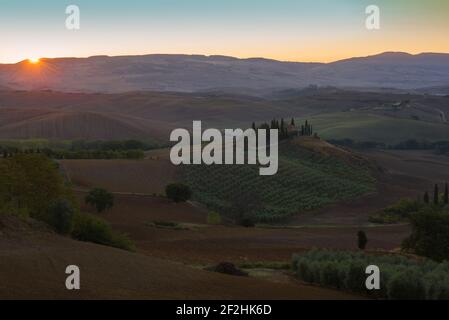 TUSCANA, ITALY - SEPTEMBER 21, 2017: Dawn rural landscape with the old villa Podere Belvedere. Neighborhoods of the city of San Quirico d'Orcia Stock Photo