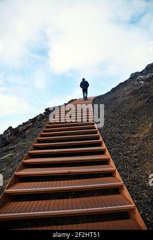 Staircase clibing the top of a volcano, Iceland Stock Photo