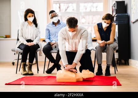 First Aid CPR Resuscitate Training In Face Mask Stock Photo