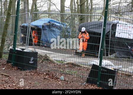 HS2 security personnel man a fence adjacent to Jones' Hill Wood, near Aylesbury Vale in Buckinghamshire, one of the woodlands which is due to be affected by the building of HS2. Picture date: Friday March 12, 2021. Stock Photo