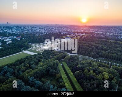 aerial Cityscape of paris in background from chateau de Sceaux (hauts de seine) in morning with trees and topiary in the foreground Stock Photo