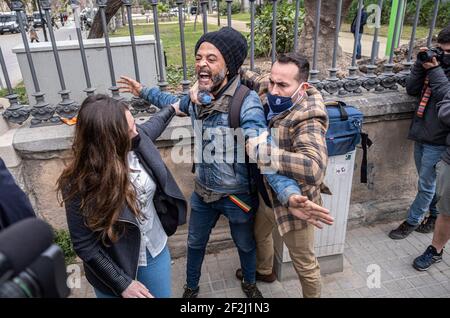 Barcelona, Spain. 12th Mar, 2021. A man is arrested after reprimanding deputies Santiago Abascal and Ignacio Garria as they walk through the door of the Ciutadella park that gives access to the Parlament de Catalunya.Press conference of the Deputy and leader of the far-right VOX party Santiago Abascal at the doors of the Catalan Parliament as he attends the first session of the new legislature with the presence of 11 VOX deputies elected in the last Catalan elections. Credit: SOPA Images Limited/Alamy Live News Stock Photo