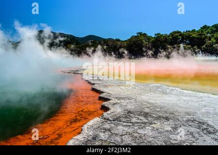 Colorful Champagne Pool in Waiotapu Thermal Wonderland. Steam rising over water surface. Rotorua, North Island, New Zealand. Stock Photo