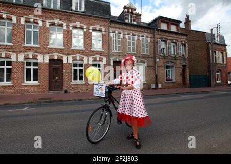 CYCLING - TOUR DE FRANCE 2012 - STAGE 4 - Abbeville > Rouen (214 km) - 04/07/2012 - PHOTO MANUEL BLONDEAU / DPPI - FAN - MARIE DUHAUPAS PICTURED NEAR THE STARTING LINE, SHE IS FROM ABBEVILLE, SHE SAW LE TOUR DE FRANCE FOR THE FIRST TIME WITH HER FATHER IN 1954 OR IN 1955 NEAR ABBEVILLE, SHE REMEMBER LOUISON BOBET AND YVETTE HORNER, SHE MADE HER DRESS ONLY TO WEAR IT DURING THE DEPARTURE OF THE STAGE IN ABBEVILLE . Stock Photo