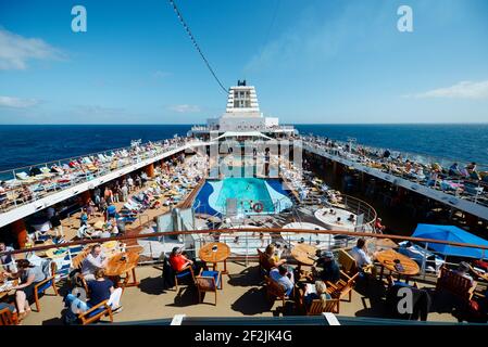 Passengers in the afternoon on the deck of a cruise ship Stock Photo