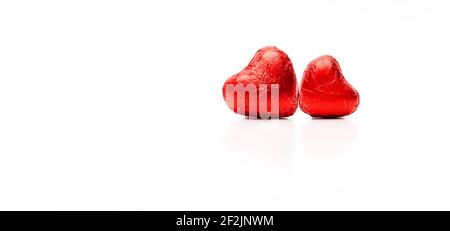 Two red chocolate hearts isolated Stock Photo