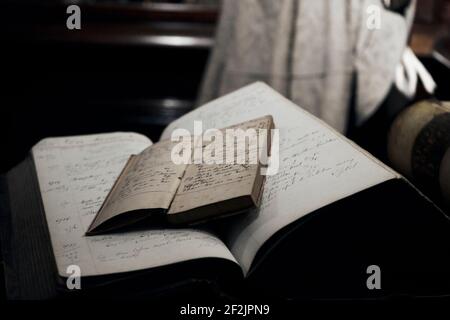 Old notebooks. Defocused noisy background. Close up Stock Photo
