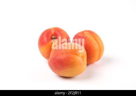Three peaches isolated on white background macro view Stock Photo