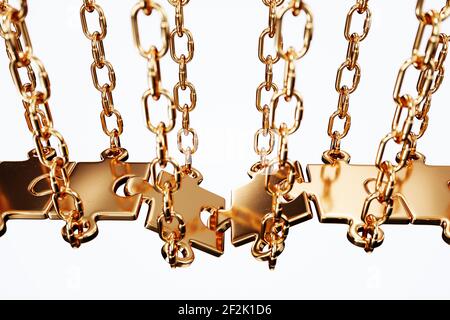 Metal gold jigsaw puzzle successful bridge connection with chain over a gap. Soft focus image Stock Photo