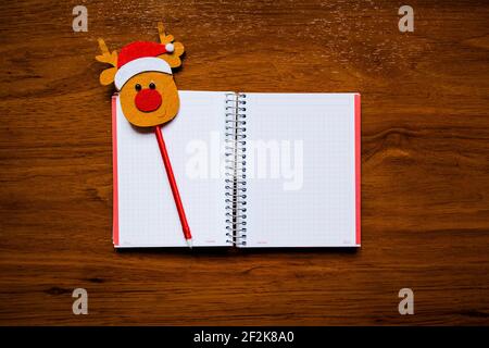 Notebook; pencil Papa Noel; red Stock Photo