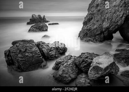 Long Exposure of El Matador State Beach Sunset with Rock in the Foreground and Crashing Waves, Malibu, California