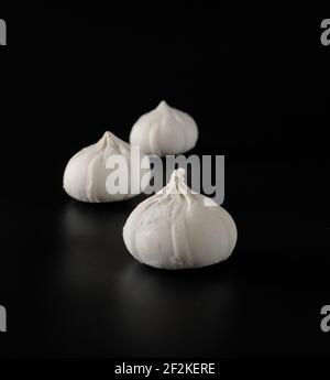 Khinkali with raw dough on a black background Stock Photo
