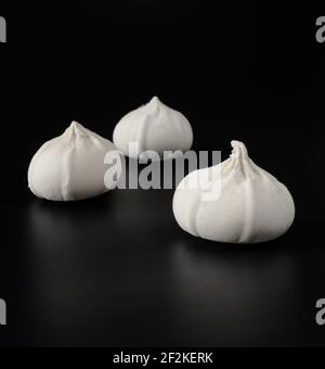 Khinkali with raw dough on a black background Stock Photo