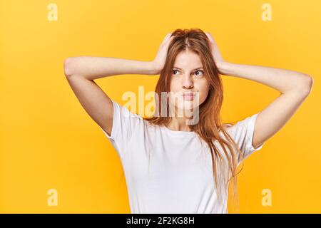 Portrait of shocked scared girl having panic holding two palms Stock Photo