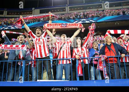 Supporters of Atletico de Madrid wave flags and scarves during the UEFA  Champions League 2013/2014 football match 1/4 Final , 2nd Leg between  Atletico Madrid and FC Barcelona on April 9, 2014 at Vicente Calderon  stadium in Madrid, France. Photo
