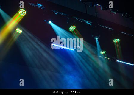 Multi color light on dark stage. Spotlights Stock Photo