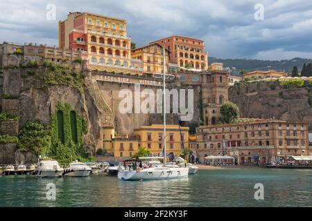 View of boat harbor and Marina Grande in Sorrento with colorful buildings and mountains in the background, Campania, Amalfi Coast, Italy Stock Photo