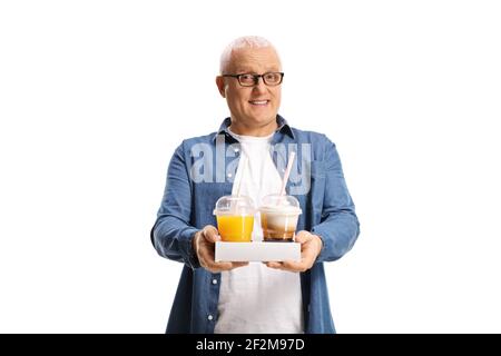 Mature man holding takeaway coffee and orange juice isolated on white background Stock Photo