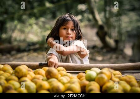 Tayrona, Magdalena, Colombia - March 2021: portrait of an Kogi indigenous Kogi child in the Parque Natural Tayrona, Magdalena, Santa Marta, Colombia Stock Photo