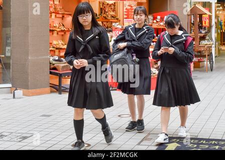 Japanese teen schoolgirls in uniforms, Kyoto, Japan Stock Photo