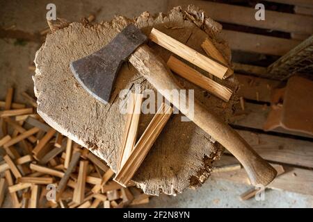 Chopping block with ax and split wood. Stock Photo