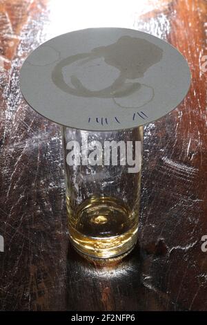 Finished drinking after 8 glasses of Koelsch. Koelsch is a specialty beer from Cologne, that is served until the coaster is placed on the glass. Stock Photo