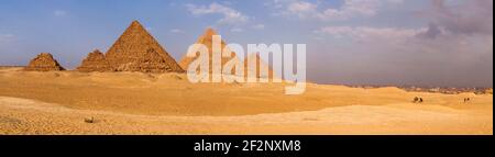 Panorama, Egypt, pyramids of Giza, camel riders, distant view distant view Stock Photo