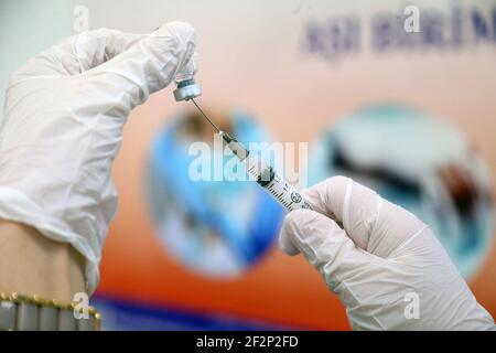 Ankara, Turkey. 12th Mar, 2021. A nurse prepares the COVID-19 vaccine in Ankara, Turkey, on March 12, 2021. Turkey reported on Friday 14,941 new COVID-19 cases, including 834 symptomatic patients, as the total number of positive cases in the country reached 2,850,930, according to its health ministry. Credit: Mustafa Kaya/Xinhua/Alamy Live News Stock Photo