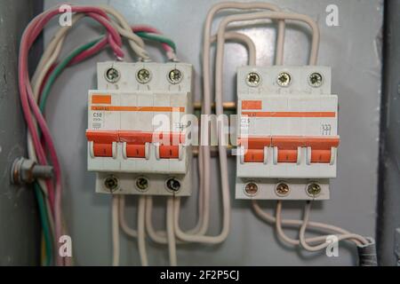 Voltage switchboard with circuit breakers. Electrical background. Stock Photo