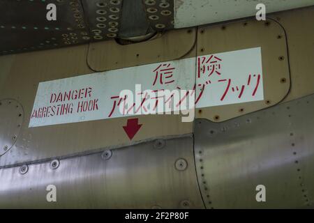 Close up detail of arrester hook warning sign on a Mitsubishi F-1 jet fighter of the Japanese Air Self-Defence Force, at Nara Base in Nara city, Japan Stock Photo