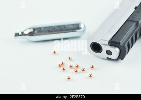 Air Gun, Co2 Cartridges and Pellets. Focus on a gun barrel. Stock Photo