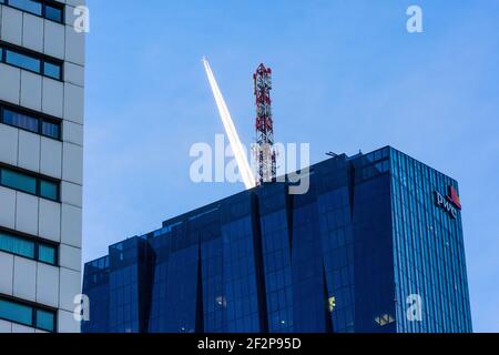 Austria, Vienna, top of DC Tower 1, aircraft, contrails, pwc logo in 22. Donaustadt, Stock Photo