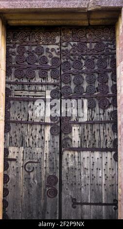 Door of the Priory Church of Marcevol. Was built in the XII century. Monument historique. Stock Photo