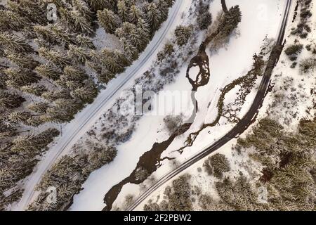 Germany, Thuringia, Ilmenau, Gehren, forest, valley, brook, forest roads, snow, Rennsteig environment, aerial view, top view Stock Photo